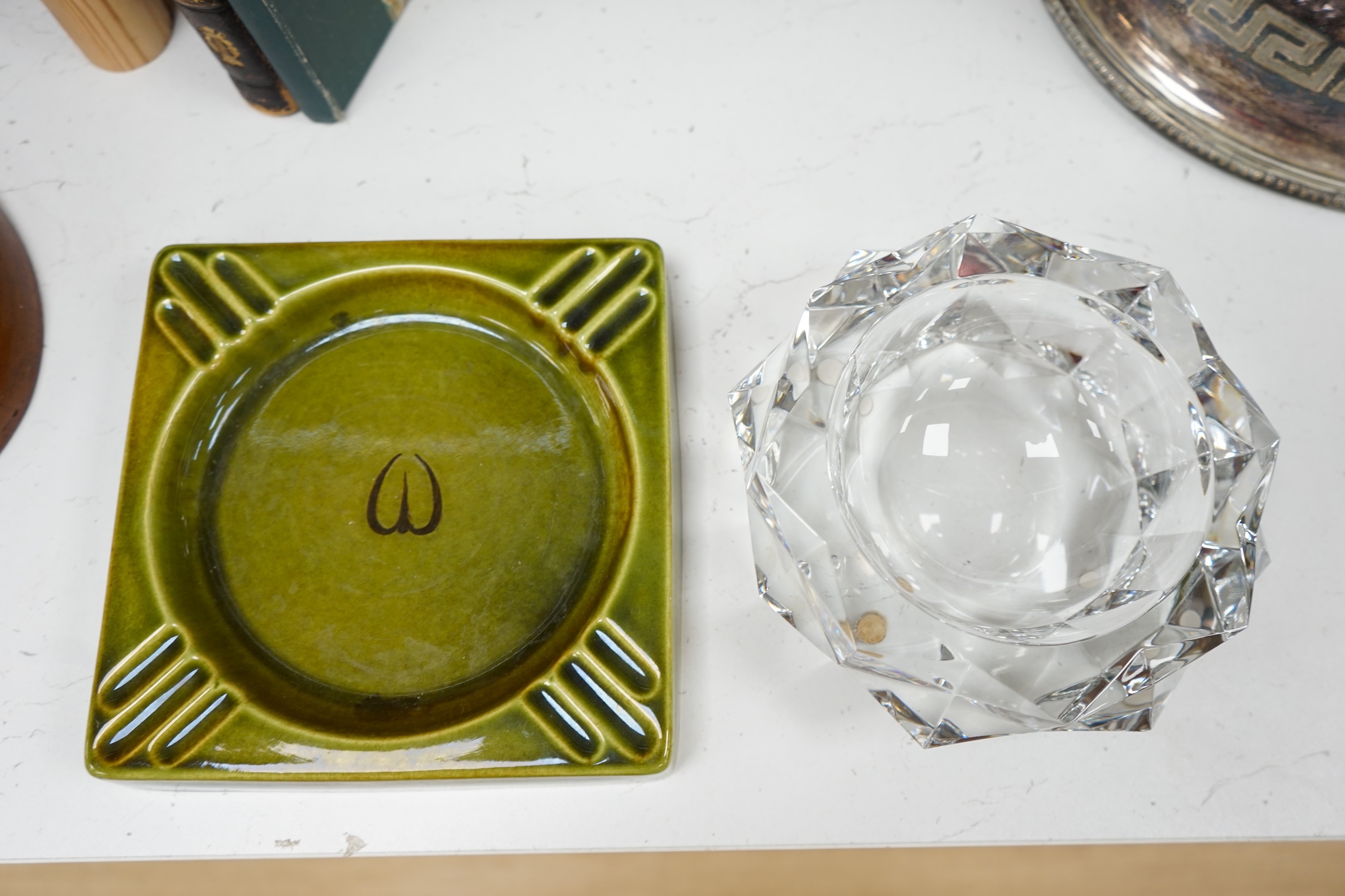 A Baccarat cut glass ashtray, 19cm diameter, and a Gefle Swedish green pottery ashtray, 20cm wide. Condition - good.